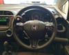 Hand controls of a Honda Fit Shuttle Hybrid Station Wagon for rent