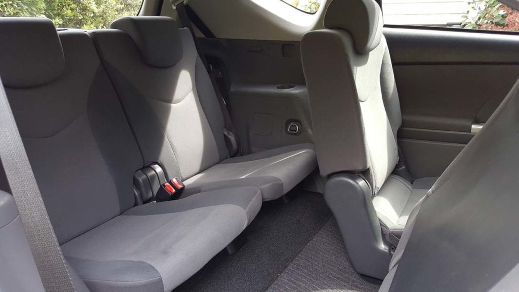 Spacious Interior of 7 seater Toyota Prius Alpha Stationwagon with left foot accelerator