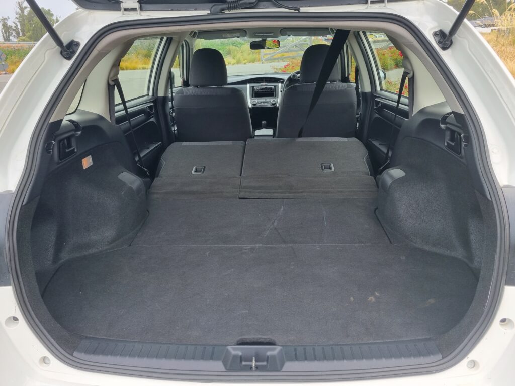 Toyota Fielder Hybrid with Hand Controls and Left Foot Accelerator interior with seats down